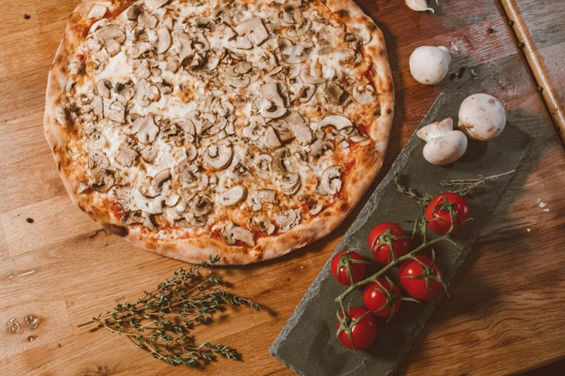 White Truffle pizza with creamy truffle sauce and mushrooms